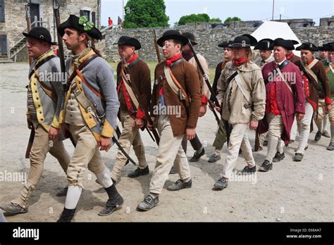 American Revolutionary War Reenactors Marching Out To Battle Stock