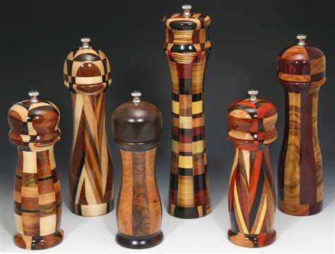 a group of wooden salt and pepper shakers