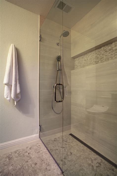 Bigger Format Tile With Flat Pebbles On The Shower Floor Is Highlighted
