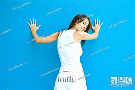 Woman In Pants With The Word Truth On Backside Standing With Hands