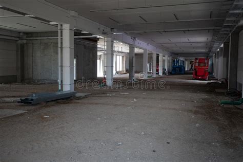 On Construction Site The Interior Finishing Of A Factory Building Takes