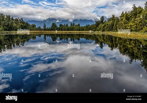 Forest Reflections In Lake Matheson South Island New Zealand Stock