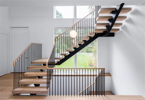 You can paint wood any color you wish, and it goes with both traditional and modern homes. Steel Spindle Railing on Floating Stairs - Hamptons, NY | Keuka Studios