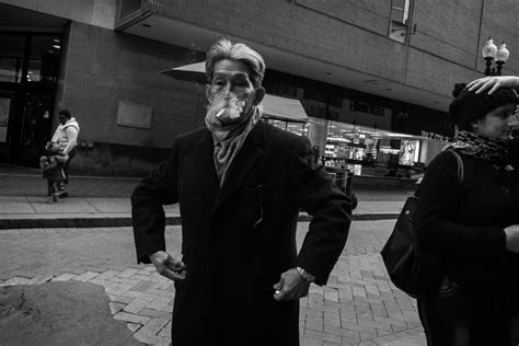 A Street Photograph Of A Man Smoking Smithsonian Photo Contest