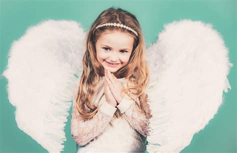 premium photo beautiful little angel girl mischievous little angel girl standing with your