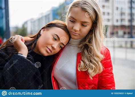 Caring Friend Consoling Unhappy Young Woman In City Stock Image Image