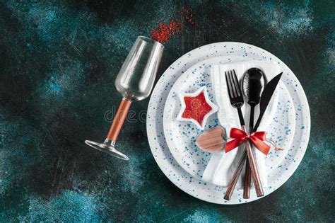 Festive Table Place Setting Crockery And Cutlery On A Dark Textured