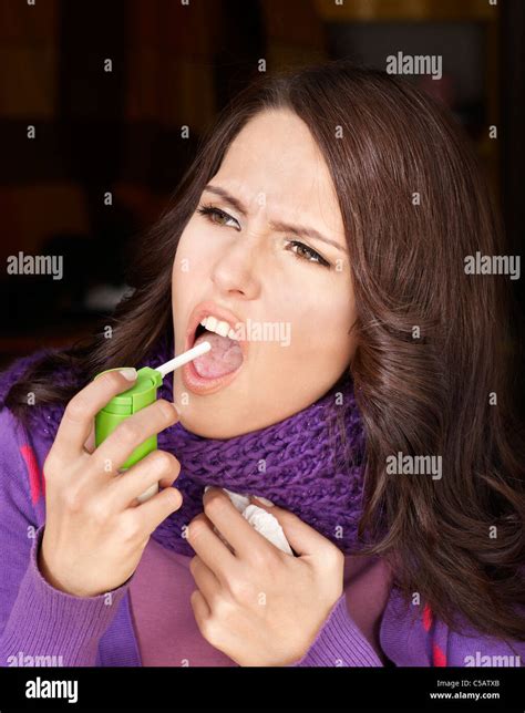 Sick Woman Using Throat Spray Stock Photo Alamy