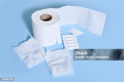 Toilet Paper Roll And Hemorrhoidal Suppositories Stock Photo Download