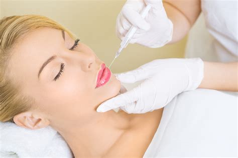 Young Woman Receiving Botox Injection In Lips Barr Aesthetics