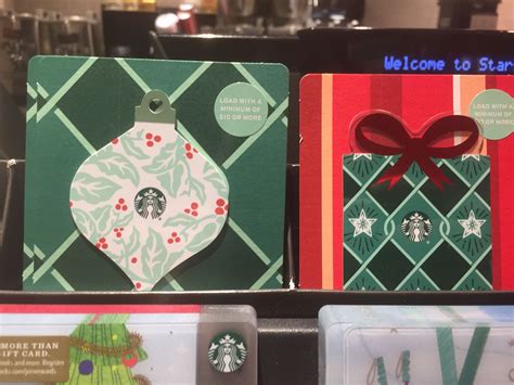 Starbucks T Cards Are On Display In A Store For Holiday Decorations