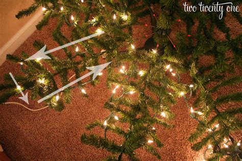 Unless you possess a happy helper, the job of stringing lights on your christmas tree is likely to fall to you each year. How to Put Lights on a Christmas Tree - Two Twenty One