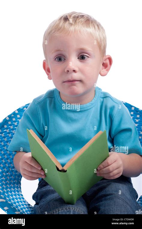 Little Boy Reading A Book Isolated On White Background Stock Photo Alamy