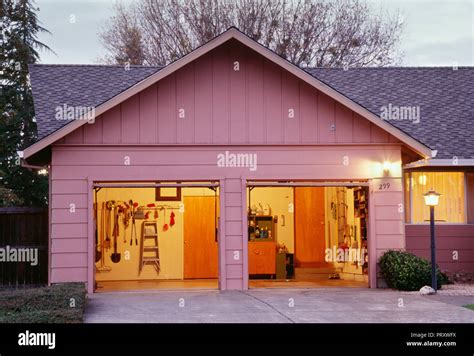 Suburban House Garage Doors Open At Night Usa Stock Photo Alamy