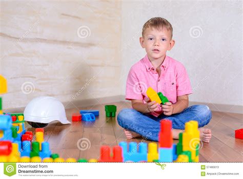 Happy Young Boy Playing With His Building Blocks Stock