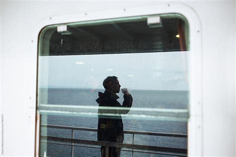 Man Smoking Cigarette On Ferry Boat Del Colaborador De Stocksy Marko Stocksy