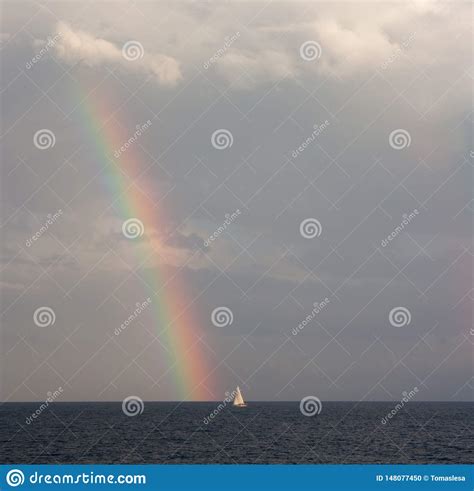 A Boat At The Sea And A Rainbow Above The Sea In Sydney Stock Photo
