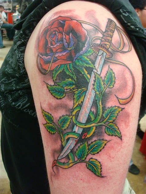 'rose' tattoo on her left thigh. Rose Tattoos - Page 11