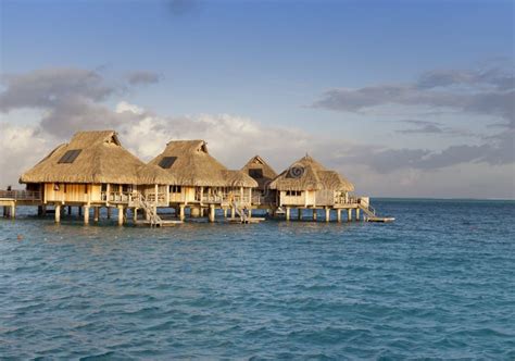 Typical Landscape Of Tropical Islands Huts Wooden Houses Over Water