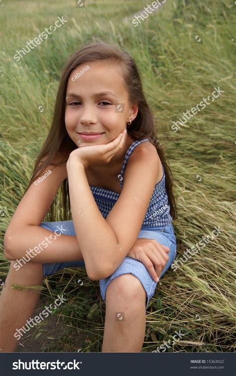 Smiling Preteen Girl Sitting On Grass Stock Photo 15363022 Shutterstock