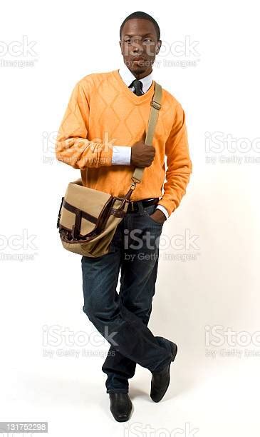 Black Male Model Pose In Hip Orange With Shoulder Bag Stock Photo