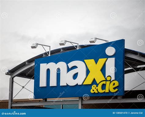 Entrance Of A Maxi And Cie Supermarket With Its Logo Editorial Image
