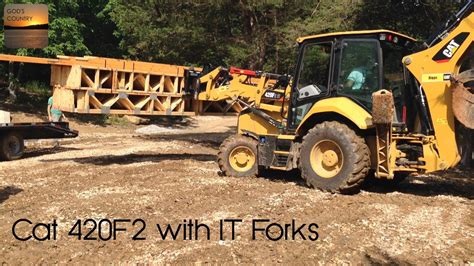 Cat 420f2 Backhoe With It Forks Unloading Floor Trusses Youtube