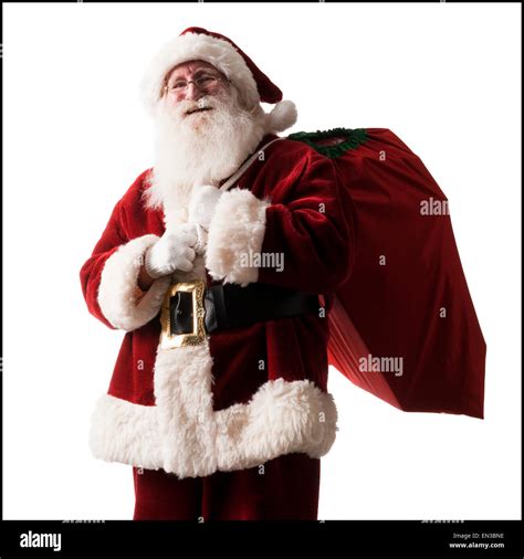 Santa Claus Carrying A Bag Of Presents Stock Photo Alamy