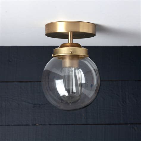 Brass Clear Glass Globe Ceiling Light Two Kings And Co