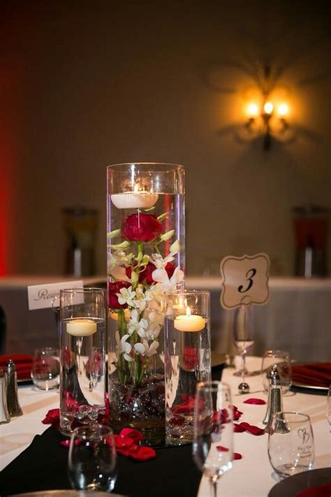 Elegant silver wedding bells, foil starburst decorations, the always popular wishing tree centerpiece, as well as black or silver metal lanterns or even the eiffel tower. Centerpiece-Red Black and White Wedding | Red wedding theme, Black wedding decorations, Black ...