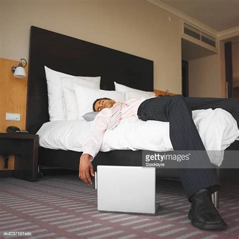 Business Man Sleeping In Hotel Bed Photos And Premium High Res Pictures