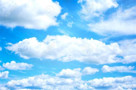 Beautiful Blue Sky And White Clouds On Background Wallpaper Stock Photo