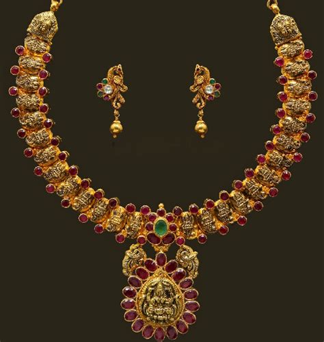 Jewellery Designs Lakshmi Motifs Antique Jewellery Ruby Necklace Set