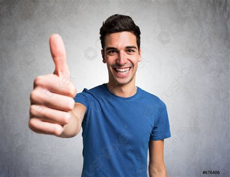 Happy Smiling Man Giving Thumbs Up Stock Photo Crushpixel