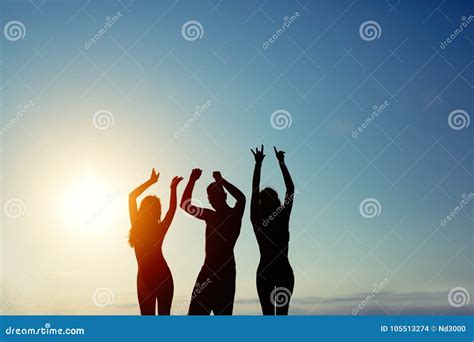 Group Of Happy Young People Enjoying Summer Sunset Stock Photo Image