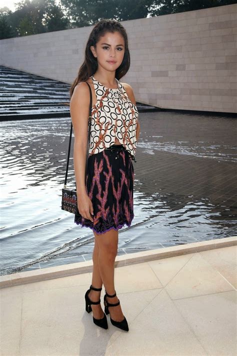 Selena Gomez Arrives In A Halter Top And Skirt To The Louis Vuitton