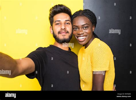 Young Mixed Race Couple Indian Man And African Woman Taking Selfie