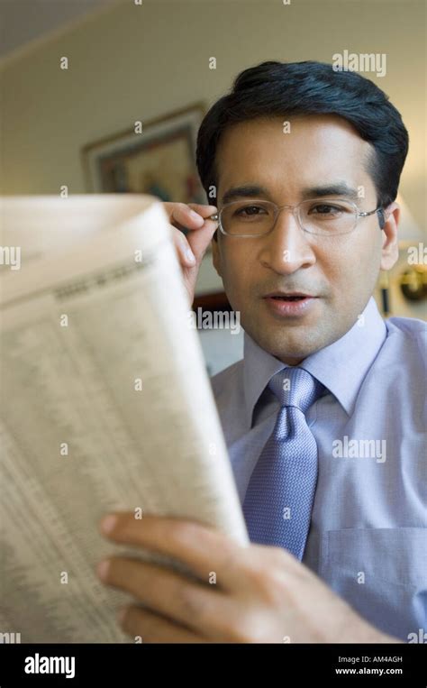 Close Up Of A Businessman Reading A Newspaper Stock Photo Alamy