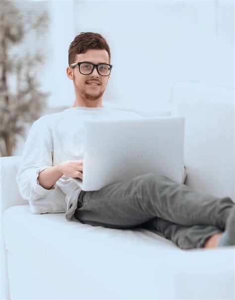 Successful Young Male Freelancer Working On Laptop At Home Stock Photo