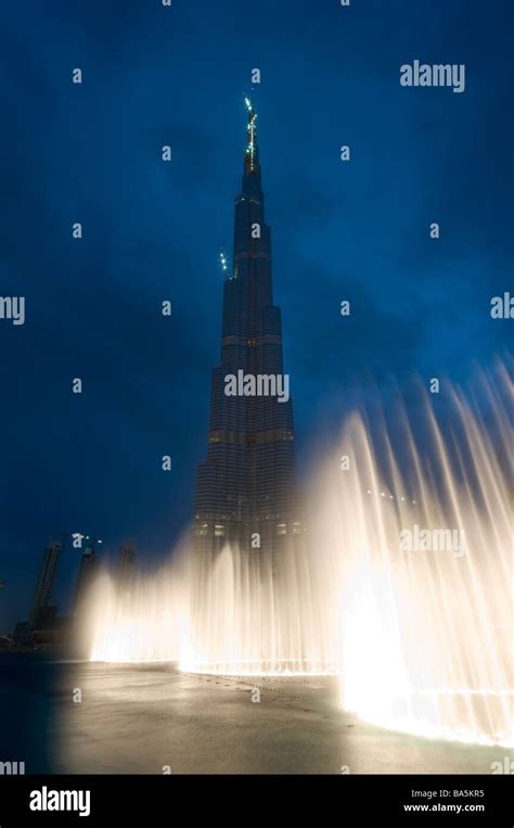 Dubai Fountains Illuminated In The Evening With The Worlds Tallest