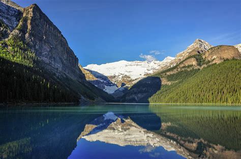 Clear Reflections In The Water At Lake Louise Canada Photograph By