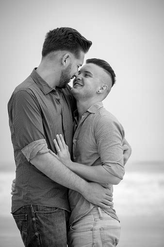 Gay Men Embracing On A Beach Stock Photo Download Image Now Adult