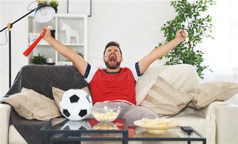 Male Soccer Fan Watching A Football Match At Home Stock Image Image
