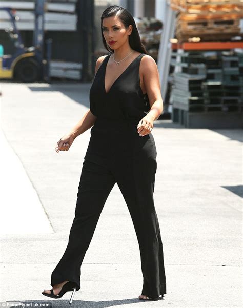 Kim Kardashian Showcases Her Svelte Figure In Plunging Black Jumpsuit