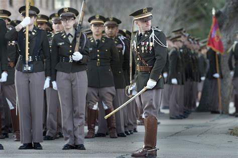 A Texas Aandm Cadet Prepares His Group For A Pass And Review Ceremony In