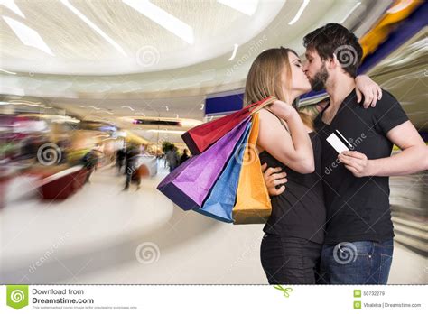 happy kissing couple with shopping bags in the mall stock image image of dating consumerism