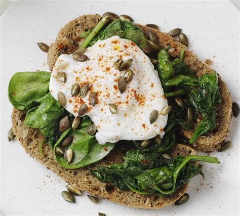 Poached Eggs Spinach And Pumpkin Seeds On Gluten Free Toast Genius
