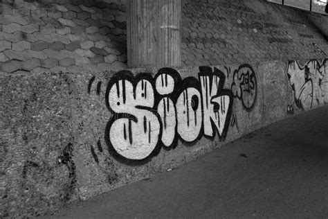 Grayscale Shot Of A Wall With Graffiti In Cologne Germany Editorial