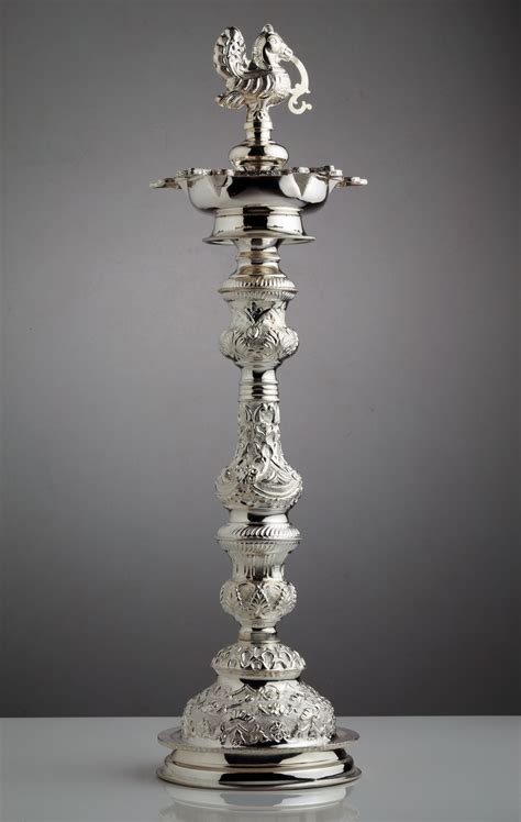 A skillfully crafted silver lamp... | Silver lamp, Silver ornaments ...