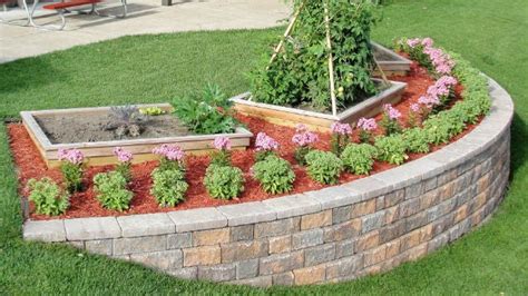 Bury half of the base block. Build A Block Retaining Wall To Beautify A Steep Slope ...